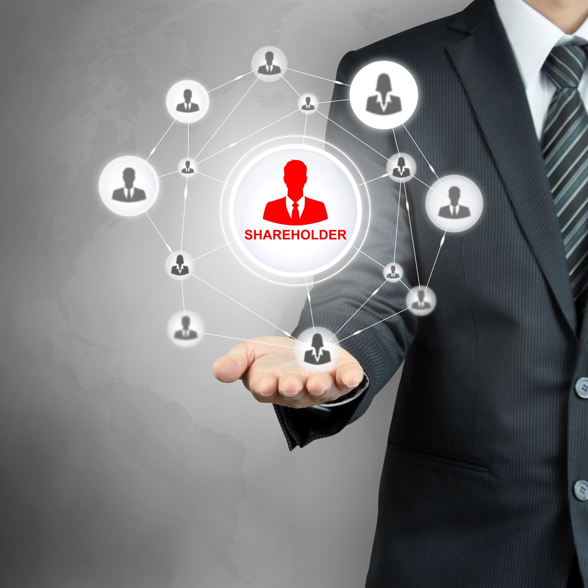 SHAREHOLDER sign on businessman hand